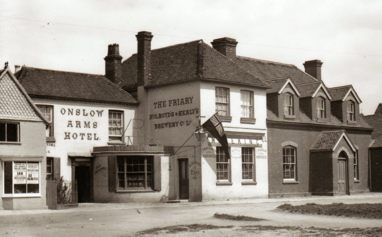 Black and white photograph of the Onslow Arms Hotel which is decorated to celebrate Mafeking