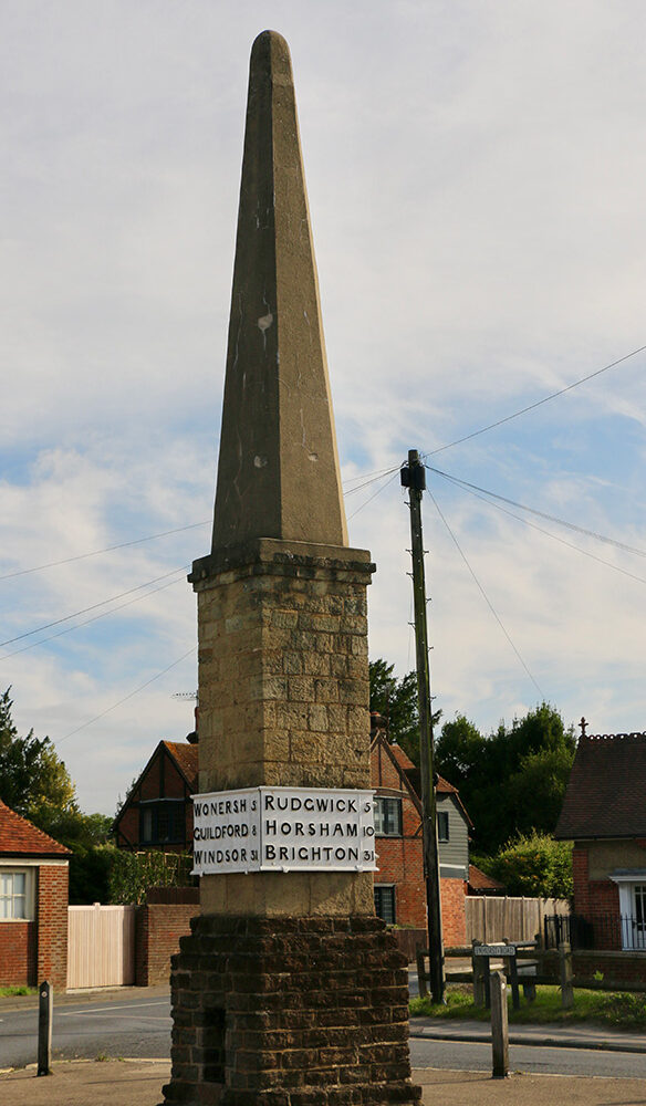 A colour photograph of the Obelisk in Cranleigh today